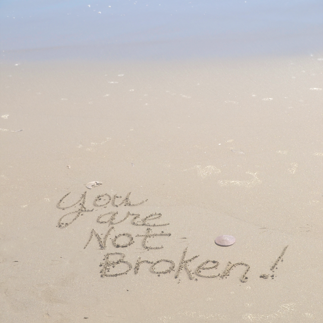 You are Not broken writing in the sand
